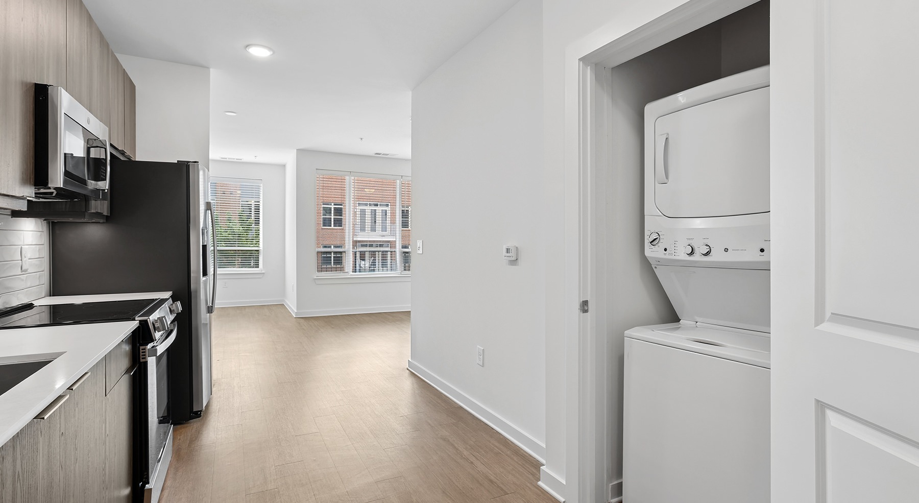 kitchen with stackable washer and dryer in a closet