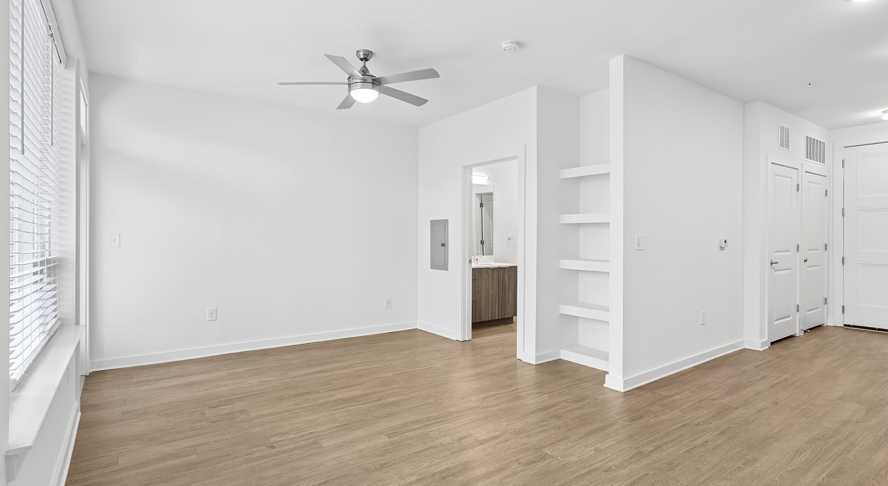 room with white walls and wood floors